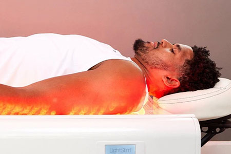 patient receiving red light treatment in Orange